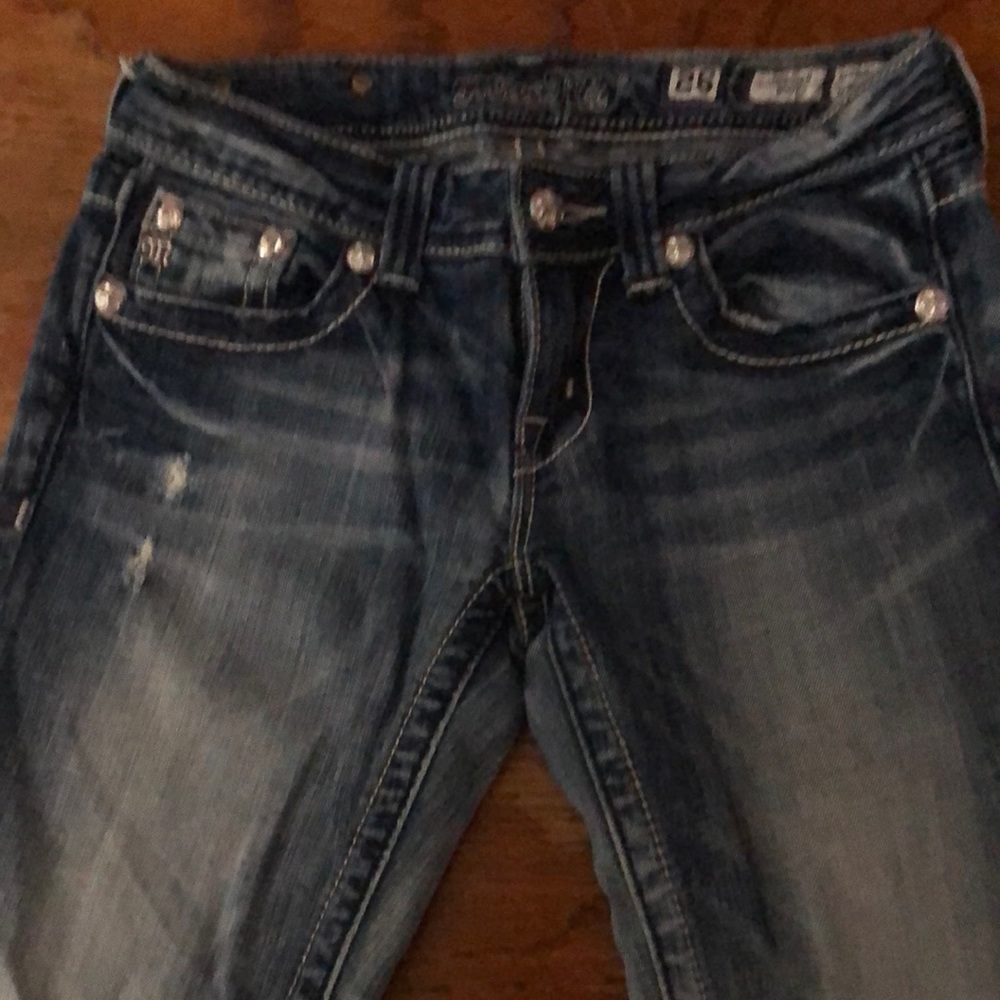 Miss Me Boot Cut jeans. Color of fading on these jeans are perfect. 34 length